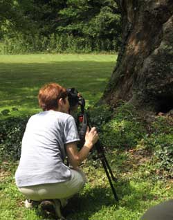 Jan Dodgins shooting photos at Arts Gathering at Mill Meadow