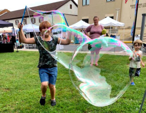 Boy with giant bubbles at Arts Fest